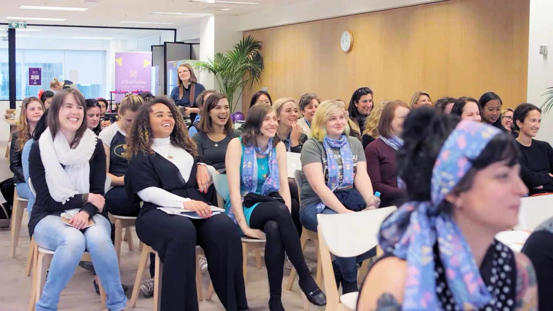 Participants listening to a speaker