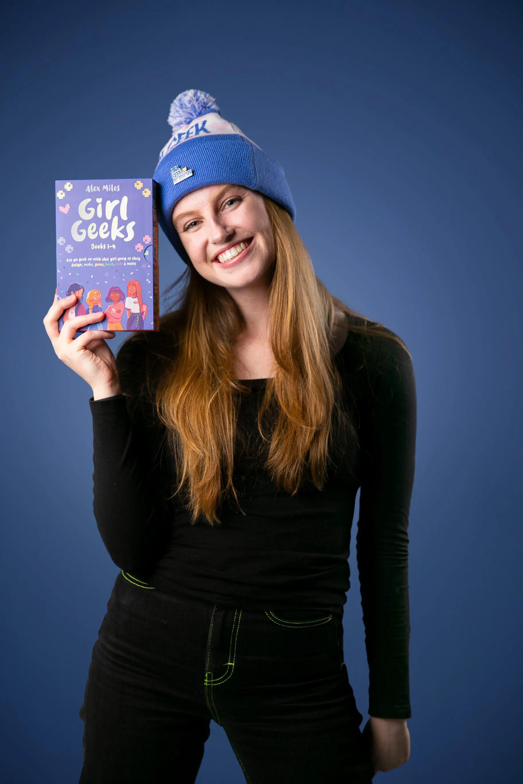A reader holding up a Girl Geeks book