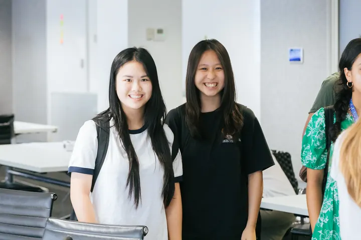 Two students smiling together