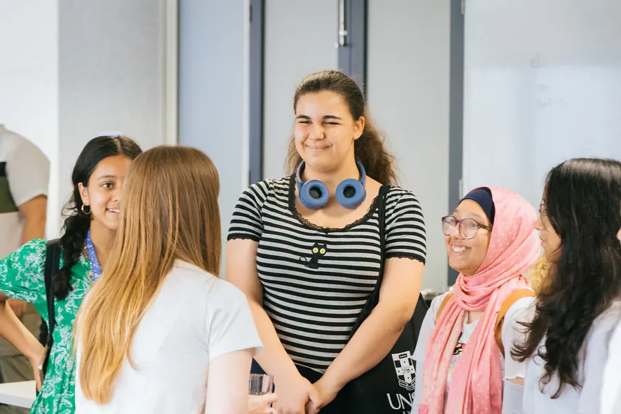 Students chatting and laughing together in a group