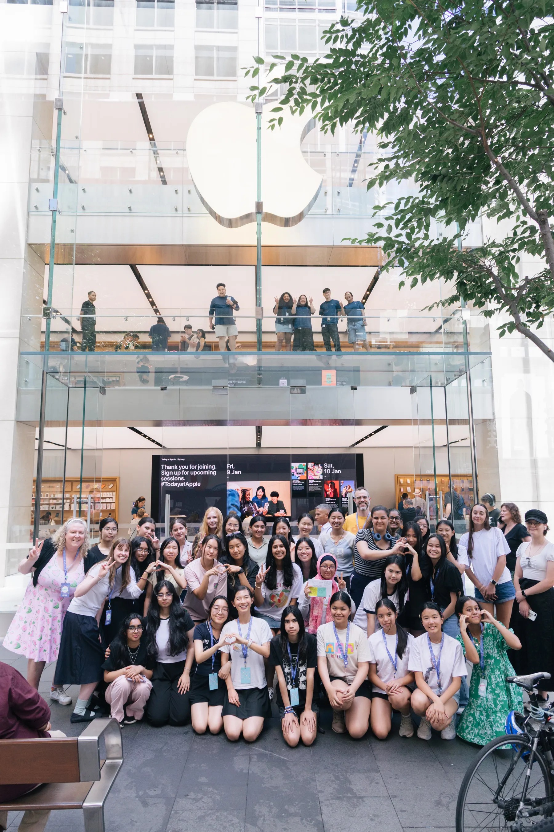 SheHacksSwift 2026 students and mentors in front of the Apple Store on George Street, Sydney